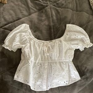 A bell sleeved top that goes well with jeans or a miniskirt